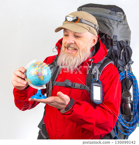 An elderly man with a white beard, wearing a red jacket and beige cap with a headlamp 130099142