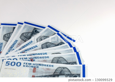 Danish kroner cash spread on white table Danish kroner cash spread on white table 130099329