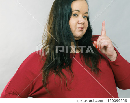Woman say no by shaking finger Woman say no by shaking finger 130099338