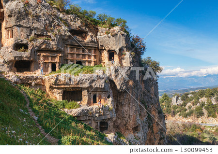 Happy family visiting ancient Greek city Tlos in Lycia located on Lycian way Famous historical and archeological site. Popular place for family travel on summer vacation. Fethiye, Mugla, Turkey Happy family visiting ancient Greek city Tlos in Lycia located on Lycian way Famous historical and archeological site. Popular place for family travel on summer vacation. Fethiye, Mugla, Turkey 130099453