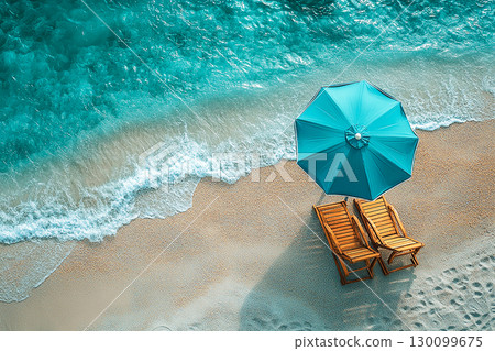 Summer joy. Top view. Umbrella and chairs set up on sand in beach of ocean. Summer joy. Top view. Umbrella and chairs set up on sand in beach of ocean. 130099675