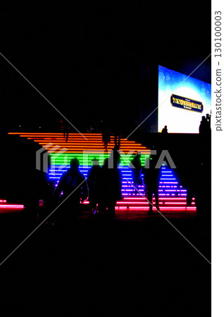 People climbing the stairs of light 130100003