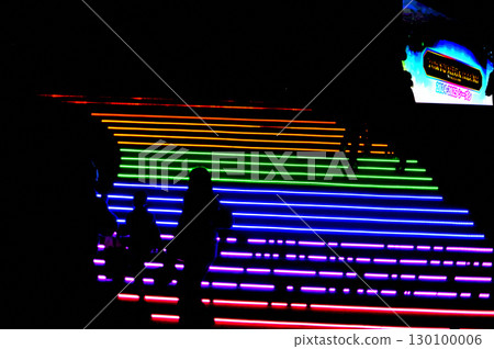 People climbing the stairs of light 130100006