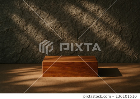 Wooden block podium with stone wall background highlighted by warm directional light 130101510