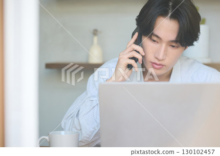 Young Asian man working from home 130102457