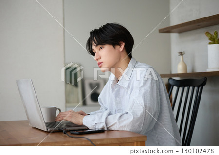 Young Asian man working from home 130102478