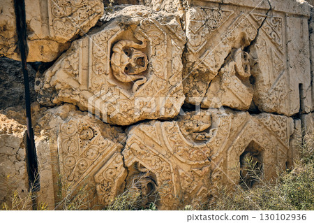 Ancient Carved Stone Wall with Ornamental Reliefs Ancient Carved Stone Wall with Ornamental Reliefs 130102936