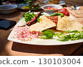 Traditional Middle Eastern Meat Flatbread with Fresh Herbs and Vegetables 130103004