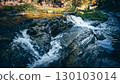Small Waterfall Flowing Over Flat Rocks in Forest Stream 130103014