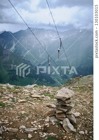 Rock Cairn and Cable Line Overlooking Mountain Valley 130103015