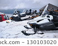 Snowmobiles Parked in Snowy Mountain Resort 130103020