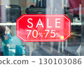 Dubai, UAE - September 26, 2024 A sign on a shop window about 70, 75 percent discounts. Editorial 130103086