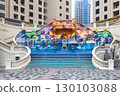Dubai, UAE - September 27, 2024 A wide, beautiful staircase between buildings with images of running horses. Editorial 130103088