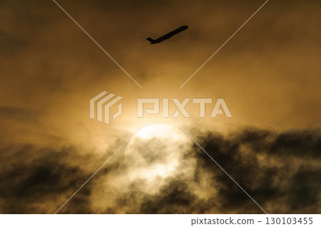 An aircraft flying against a beautiful sky and clouds An aircraft flying against a beautiful sky and clouds 130103455