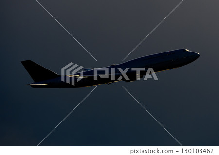 An aircraft flying against a beautiful sky and clouds 130103462