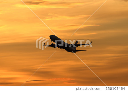 An aircraft flying against a beautiful sky and clouds 130103464