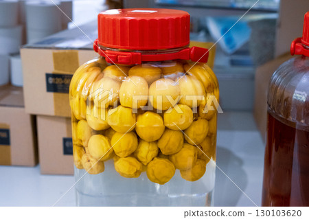 Making plum wine Making plum wine 130103620