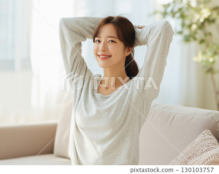 A happy morning scene starting the day with stretching in natural light 130103757