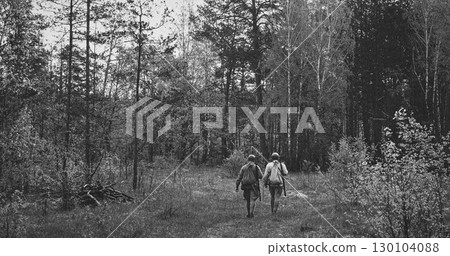 Black-and-White Soldiers Marching Through Dense Forest 130104088