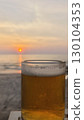 glass of beer on the beach 130104353