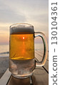 glass of beer on the beach 130104361