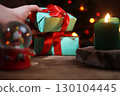 Preparing Gifts for Christmas Eve on a Wooden Table in the Living Room 130104445