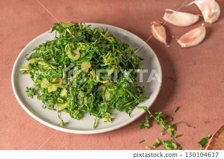 Galician cabbage cut into julienne strips. Usually used to make caldo verde, a traditional Portuguese soup Galician cabbage cut into julienne strips. Usually used to make caldo verde, a traditional Portuguese soup 130104617