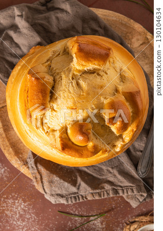 Fogaca on kitchen countertop. Fogaca is a traditional cake from Santa Maria da Feira, Aveiro, Portugal 130104634