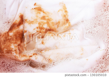 Soaking stained white clothes in detergent for laundry and hygiene Soaking stained white clothes in detergent for laundry and hygiene 130105010