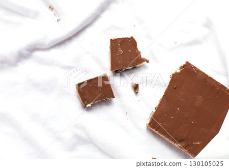 Milk chocolate bar depicting concept of laundry or dirtiness Milk chocolate bar depicting concept of laundry or dirtiness 130105025