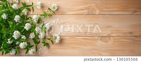 Top-down view of an arrangement of fresh wildflowers with morning dew, on a rustic wooden table Wildflowers, Natural Simplicity 130105508