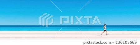 Lone runner in athletic clothing jogging on a pristine white sand beach with clear blue ocean and sky in the background showcasing a healthy active and adventurous lifestyle 130105669