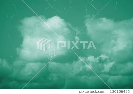 Vintage aged photo of a cloudy sky with scuffs and scratches. Vintage aged photo of a cloudy sky with scuffs and scratches. 130106435
