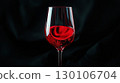 Glass of red wine on black smoky background elegant 130106704