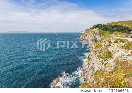 Lulworth Cove limestone cliffs above the English Channel, Dorset Jurassic Coast seascape 130106898