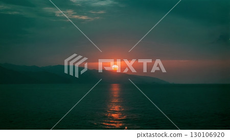 Sunset Over Ocean, Serene Ending, Reflective Moment, Coastal Peace. Ideal for relaxation, meditation, travel 130106920