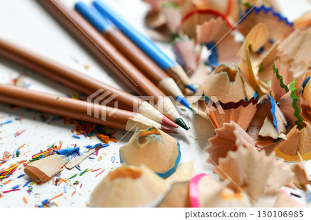 Wooden colorful pencils with sharpening shavings, on a white background Wooden colorful pencils with sharpening shavings, on a white background 130106985