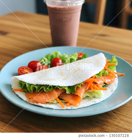 Folded tapioca with textured surface filled with salmon, lettuce, and carrots, served on a blue plate with a side salad. Generative AI. 130107228