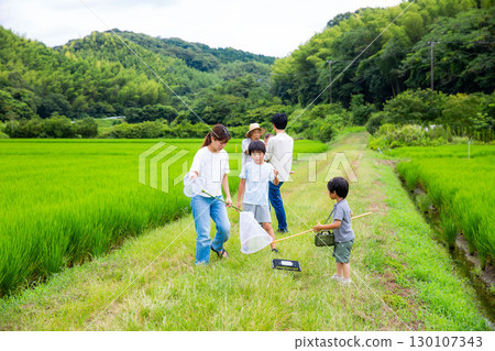 Homecoming: Japanese family having fun in their hometown during summer vacation Homecoming: Japanese family having fun in their hometown during summer vacation 130107343