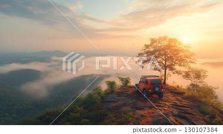 Off-Road Vehicle on Mountain Ridge at Sunrise 130107384