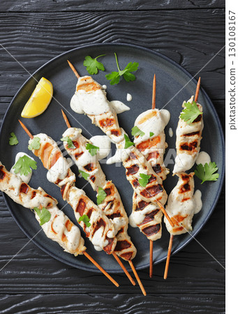 Greek style grilled chicken souvlaki on a plate Greek style grilled chicken souvlaki on a plate 130108167
