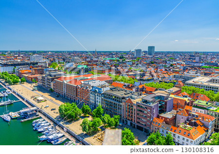 Antwerp cityscape, aerial panoramic view of Antwerp city, embankment promenade of Bonaparte Dock, quay harbour with yachts motor boats, skyline panorama of Antwerpen old town, Flemish Region, Belgium Antwerp cityscape, aerial panoramic view of Antwerp city, embankment promenade of Bonaparte Dock, quay harbour with yachts motor boats, skyline panorama of Antwerpen old town, Flemish Region, Belgium 130108316