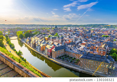 Namur cityscape, aerial panoramic view of Namur city historical center with Sambre river embankment and St Aubin's cathedral, skyline panorama of Namur fields on horizon, Wallonia Region, Belgium 130108321