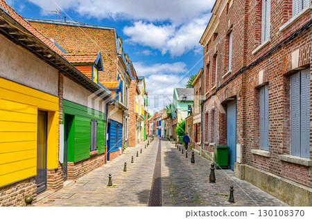 Colorful houses of Amiens historical city centre Saint-Leu quarter. Narrow cozy street between brick buildings old town in France, Picardy, Somme department, Hauts-de-France Region, Northern France Colorful houses of Amiens historical city centre Saint-Leu quarter. Narrow cozy street between brick buildings old town in France, Picardy, Somme department, Hauts-de-France Region, Northern France 130108370