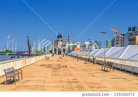Embankment promenade of Scheldt river on Cruise ponton and Maritiem Park Afdaken, port area in Antwerp city historical centre, Antwerpen old town, Flemish Region, Belgium Embankment promenade of Scheldt river on Cruise ponton and Maritiem Park Afdaken, port area in Antwerp city historical centre, Antwerpen old town, Flemish Region, Belgium 130108372