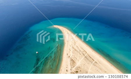 Stunning aerial perspective of Possidi cape's white sandy beach extending into the vibrant turquoise waters of the Aegean sea, Greece, creating a picturesque summer seascape Stunning aerial perspective of Possidi cape's white sandy beach extending into the vibrant turquoise waters of the Aegean sea, Greece, creating a picturesque summer seascape 130108574