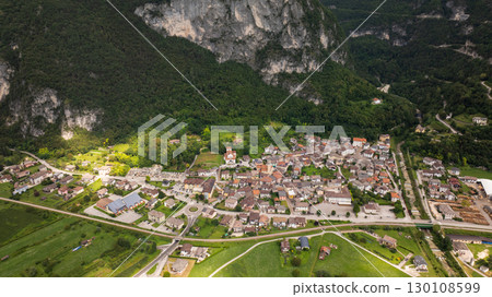 Aerial view of Grigno, a charming town in Valsugana valley, Trento province, Italy, surrounded by mountains and lush vegetation 130108599