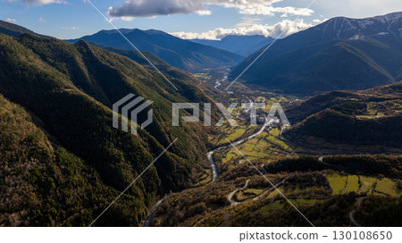 Aerial view of the Arazas river flowing through the Ordesa valley in the Huesca Pyrenees, Aragon, Spain, with lush vegetation and winding roads Aerial view of the Arazas river flowing through the Ordesa valley in the Huesca Pyrenees, Aragon, Spain, with lush vegetation and winding roads 130108650