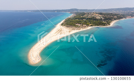 Aerial view of Possidi cape, a popular tourist destination in Kassandra, Khalkidhiki, Greece, showing clear turquoise water and a sandy beach 130108655