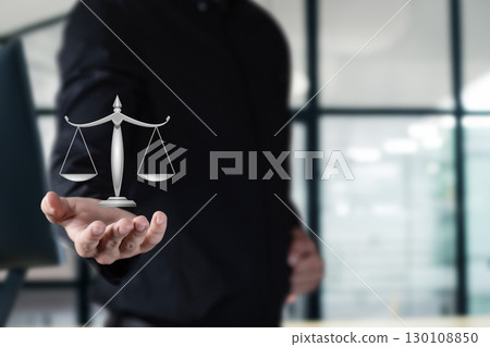 Balancing justice in a modern office setting today. Balancing justice in a modern office setting today. 130108850